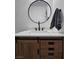 Charming bathroom features round mirror, modern vanity and light countertop at 10215 Radcliffe Peak Ave, Las Vegas, NV 89166