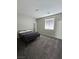 Simple bedroom with a window and comfortable bed at 10215 Radcliffe Peak Ave, Las Vegas, NV 89166
