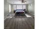 Bedroom featuring an area rug, lots of natural light and an en-suite bathroom at 10215 Radcliffe Peak Ave, Las Vegas, NV 89166