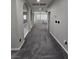 Upstairs hallway features modern archways and plush carpet at 10215 Radcliffe Peak Ave, Las Vegas, NV 89166