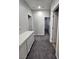 Upstairs hallway features modern lighting and carpet at 10215 Radcliffe Peak Ave, Las Vegas, NV 89166