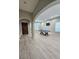 Spacious living area with light-colored flooring, abundant natural light, and a pool table at 10215 Radcliffe Peak Ave, Las Vegas, NV 89166