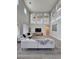 Spacious living room showcasing a large couch, high ceilings and eye-catching archways at 10215 Radcliffe Peak Ave, Las Vegas, NV 89166
