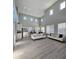 Open floor plan featuring two couches, high ceilings, and lots of natural light at 10215 Radcliffe Peak Ave, Las Vegas, NV 89166