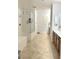 Bright bathroom featuring tile floors, walk-in shower and soaking tub at 10220 Radcliffe Peak Ave, Las Vegas, NV 89166