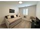 Cozy bedroom with neutral decor, plantation shutters, and modern furniture at 10220 Radcliffe Peak Ave, Las Vegas, NV 89166