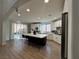 Open concept kitchen features a large center island, stainless steel appliances, and lots of natural light at 10220 Radcliffe Peak Ave, Las Vegas, NV 89166