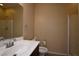 Compact bathroom featuring a single sink vanity and walk-in shower at 10511 Loma Portal Ave, Las Vegas, NV 89166