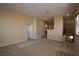 Spacious bonus room featuring neutral carpet and tan walls, adjacent to the landing at 10511 Loma Portal Ave, Las Vegas, NV 89166