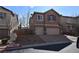 Charming two-story home with a two-car garage and a well-maintained front yard at 10511 Loma Portal Ave, Las Vegas, NV 89166