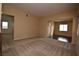 Bright living room with neutral walls, a mix of carpeted and hardwood flooring at 10511 Loma Portal Ave, Las Vegas, NV 89166