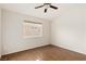 Empty bedroom featuring wood floors and a large window at 1101 Devon Downs Ave, Henderson, NV 89015