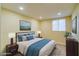 Comfortable bedroom with neutral decor and natural light, creating a restful and inviting space at 1306 Capri Dr # C, Boulder City, NV 89005