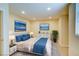 Serene bedroom with neutral tones and ample lighting, designed for restful relaxation and comfort at 1306 Capri Dr # C, Boulder City, NV 89005