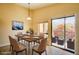 Dining room with balcony access, offering seamless indoor-outdoor dining and entertaining experiences at 1306 Capri Dr # C, Boulder City, NV 89005