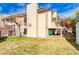 Charming two-story home featuring a private balcony, stucco siding, and lush, low-maintenance landscaping at 1306 Capri Dr # C, Boulder City, NV 89005