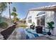 Backyard features a covered patio, manicured lawn and desert landscaping at 1323 Winter Solstice Ave, Henderson, NV 89014
