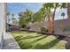 Spacious backyard includes lush lawn and desert landscaping at 1323 Winter Solstice Ave, Henderson, NV 89014