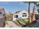 Large backyard with manicured lawn, rock landscaping and beautiful palm trees at 1323 Winter Solstice Ave, Henderson, NV 89014