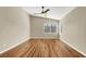 Bedroom featuring wood floors, high ceilings, a ceiling fan, and multiple windows at 1323 Winter Solstice Ave, Henderson, NV 89014
