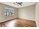 Bright bedroom features a ceiling fan, window for natural light and hardwood floors at 1323 Winter Solstice Ave, Henderson, NV 89014