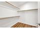 Walk-in closet with wood floors and shelving at 1323 Winter Solstice Ave, Henderson, NV 89014