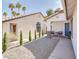 Charming single-story home featuring a rock garden, walking path, and private front courtyard at 1323 Winter Solstice Ave, Henderson, NV 89014