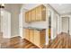 Hallway with wood floors and wood cabinets at 1323 Winter Solstice Ave, Henderson, NV 89014
