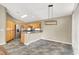 Open kitchen with breakfast bar and stainless steel appliances at 1323 Winter Solstice Ave, Henderson, NV 89014