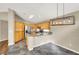 Kitchen with wood cabinets, breakfast bar, and stainless steel appliances at 1323 Winter Solstice Ave, Henderson, NV 89014