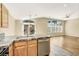 Kitchen features granite countertop and stainless steel dishwasher at 1323 Winter Solstice Ave, Henderson, NV 89014