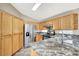 Kitchen featuring stainless appliances, granite counters and wood cabinets at 1323 Winter Solstice Ave, Henderson, NV 89014