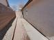 Side yard features a walkway and low maintenance rock landscaping at 1323 Winter Solstice Ave, Henderson, NV 89014