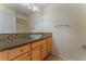 Bathroom featuring glass vessel sink, granite countertop, and decorative tile backsplash at 1405 San Juan Hills Dr # 104, Las Vegas, NV 89134