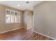 Neutral bedroom featuring hardwood flooring, and a window with shutters at 1405 San Juan Hills Dr # 104, Las Vegas, NV 89134