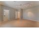 Bedroom with neutral-colored carpet and walls, ceiling lights, and walk-in closet at 1405 San Juan Hills Dr # 104, Las Vegas, NV 89134