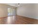 Bedroom with wood floors, ceiling fan and sliding glass door that opens to the outdoors at 1405 San Juan Hills Dr # 104, Las Vegas, NV 89134