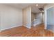 Second floor hallway with wood floors and neutral paint, connects to the stairs at 1405 San Juan Hills Dr # 104, Las Vegas, NV 89134