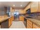 Modern kitchen boasting stainless steel appliances, granite countertops and a tile backsplash at 1405 San Juan Hills Dr # 104, Las Vegas, NV 89134