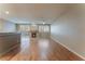 Open living space with wood floors, fireplace, and sliding doors to the backyard at 1405 San Juan Hills Dr # 104, Las Vegas, NV 89134