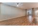 Large, open living area with wood floors, large pillars, and natural light at 1405 San Juan Hills Dr # 104, Las Vegas, NV 89134