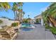 Beautiful backyard showcasing a pool, spa, outdoor seating, and a built-in grill for outdoor enjoyment at 174 Buena Ct, Henderson, NV 89074