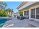 Inviting backyard features a sparkling pool, covered patio with seating, and outdoor kitchen for stylish entertaining at 174 Buena Ct, Henderson, NV 89074