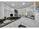 Large bar area with custom built-ins, granite countertops, and sleek fixtures at 174 Buena Ct, Henderson, NV 89074