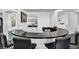 Large bar area with custom counter, four bar chairs and open layout at 174 Buena Ct, Henderson, NV 89074