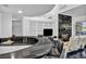 This home features a bar with a sink, granite countertops, and seating at 174 Buena Ct, Henderson, NV 89074