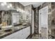 Chic bathroom with dual sinks, white cabinets, and elegant marble finishes at 174 Buena Ct, Henderson, NV 89074