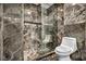 Sleek bathroom offers tiled walls and floors and updated fixtures at 174 Buena Ct, Henderson, NV 89074