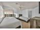 Charming bedroom featuring two beds, neutral carpet, and ample natural light at 174 Buena Ct, Henderson, NV 89074