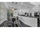 This bright dining room offers ample seating and modern lighting at 174 Buena Ct, Henderson, NV 89074